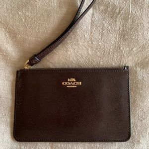 shiny purple leather Coach wristlet